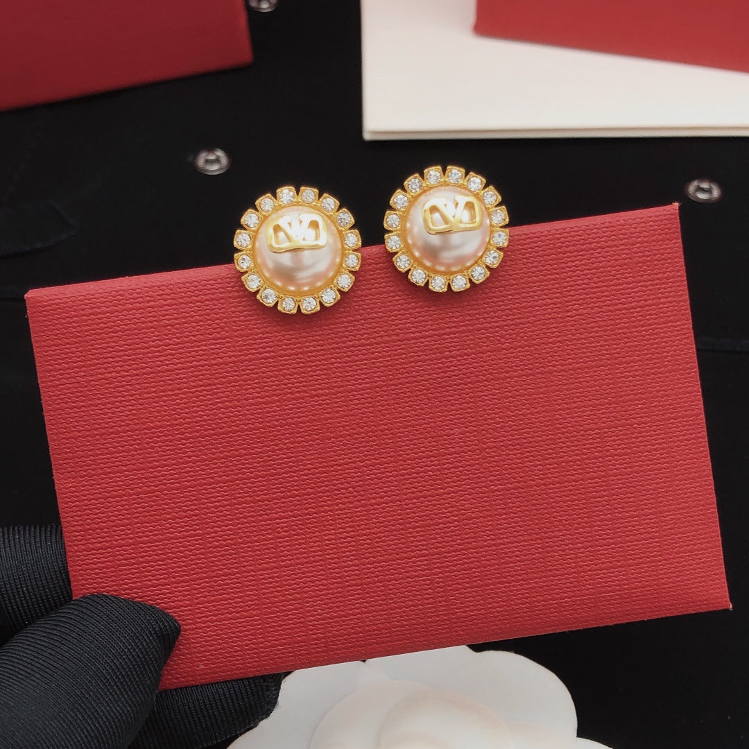 Martin Graham stud earrings in polished metal-tone – detail view