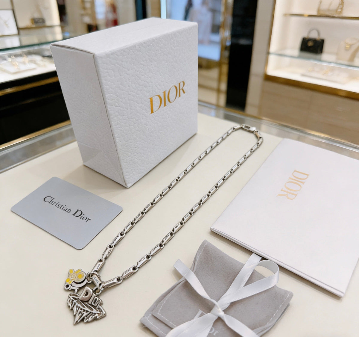 Martin Graham pendant necklace in polished metal-tone – detail view
