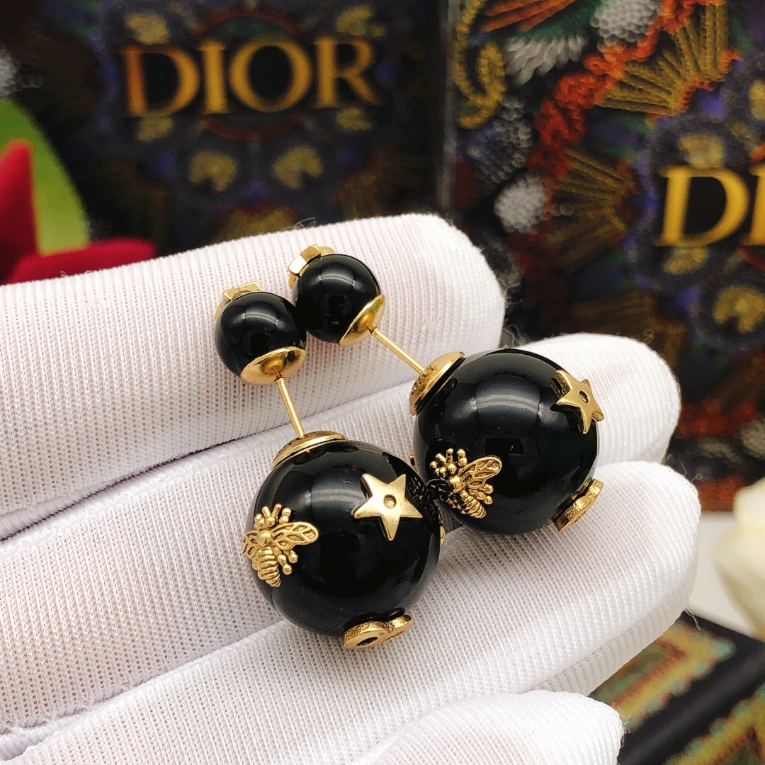 Martin Graham stud earrings in polished metal-tone – detail view