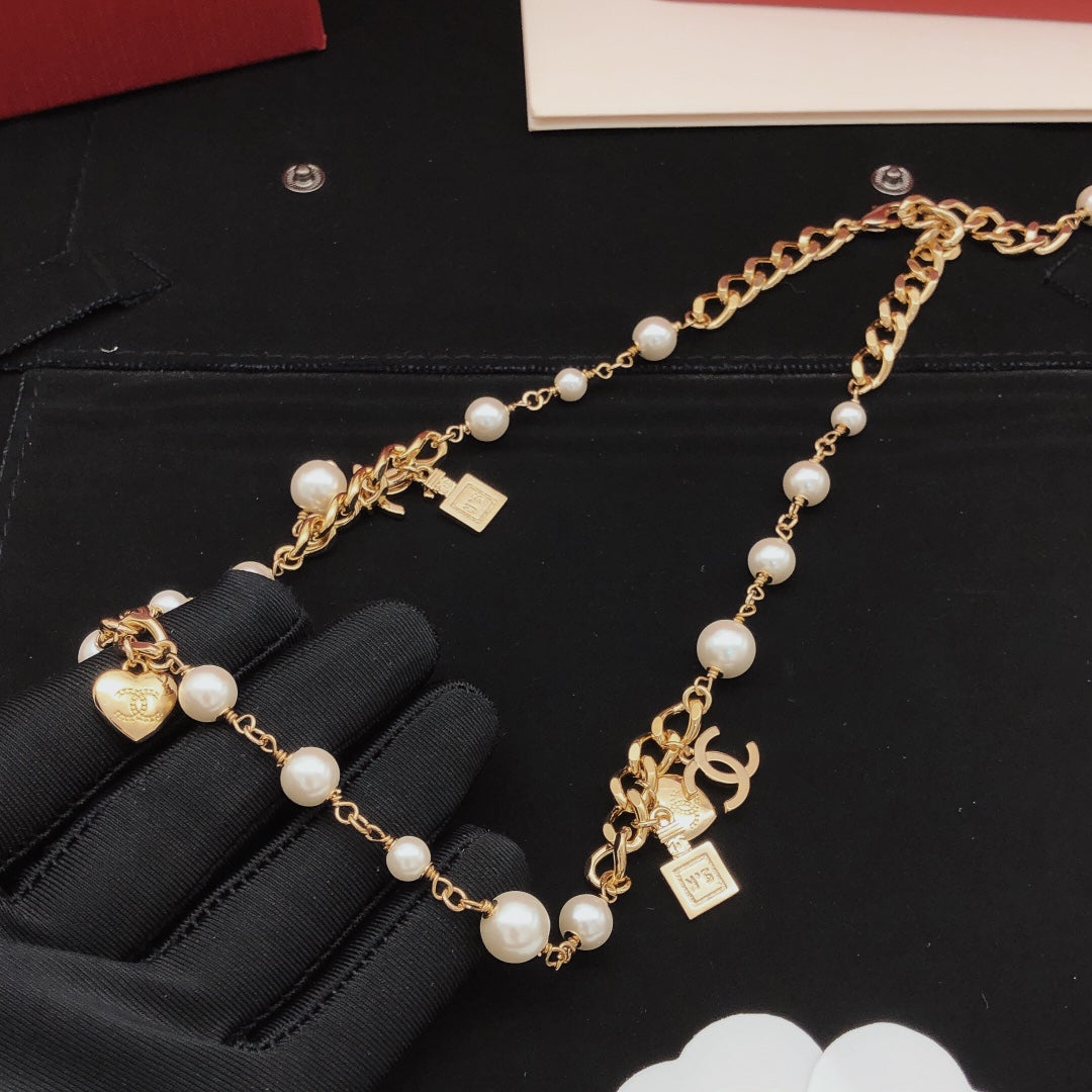 Martin Graham pendant necklace in polished metal-tone – detail view