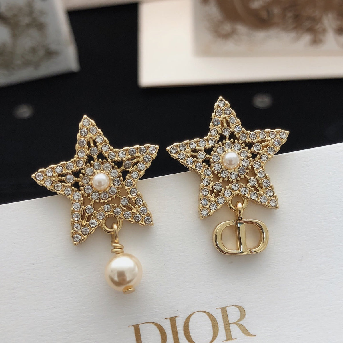 Martin Graham stud earrings in polished metal-tone – detail view