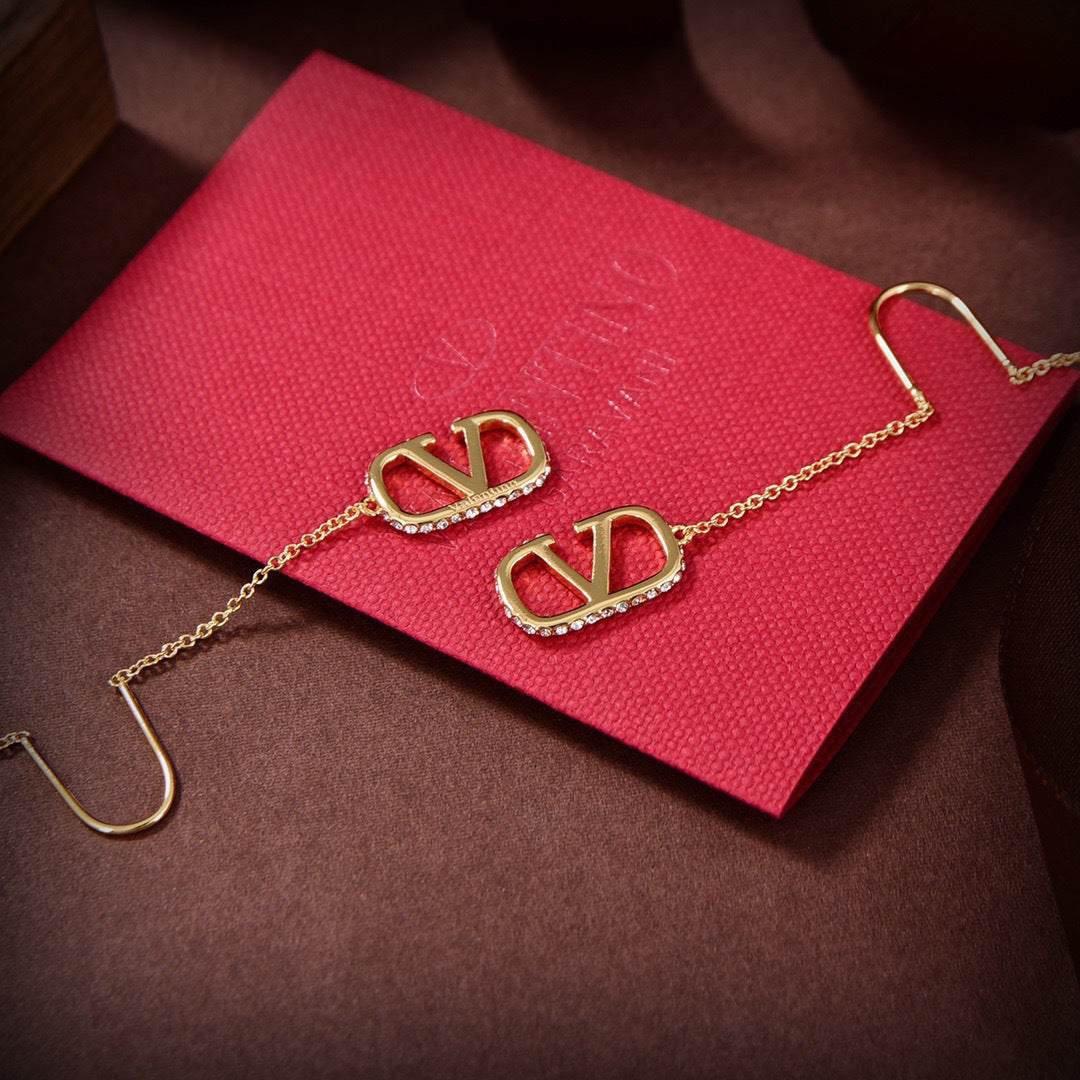 Martin Graham stud earrings in polished metal-tone – detail view