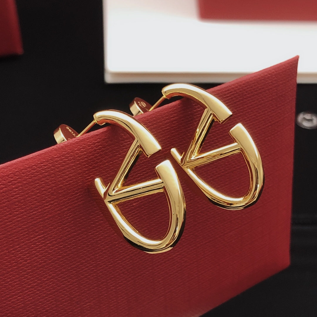 Martin Graham stud earrings in polished metal-tone – detail view
