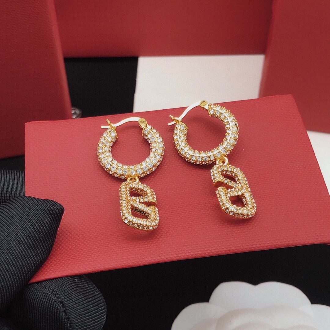 Martin Graham drop earrings in polished metal-tone – detail view