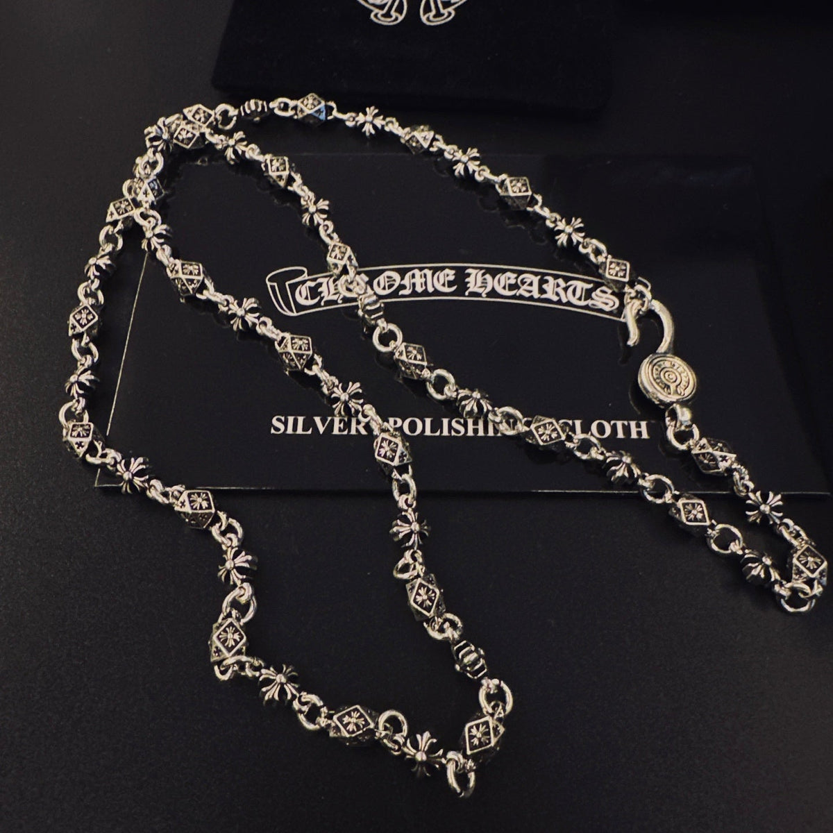 Martin Graham pendant necklace in polished metal-tone – detail view