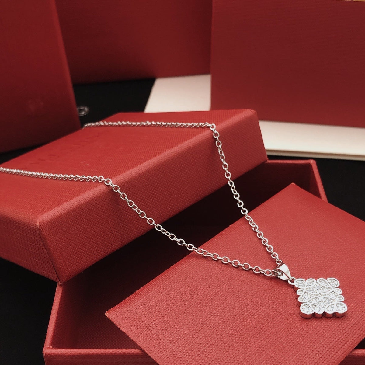Martin Graham pendant necklace in polished metal-tone – detail view