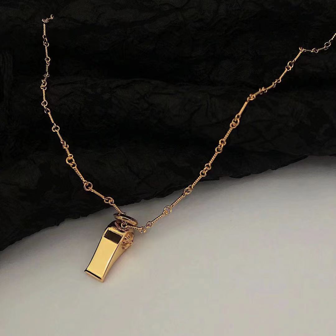 Martin Graham pendant necklace in polished metal-tone – detail view