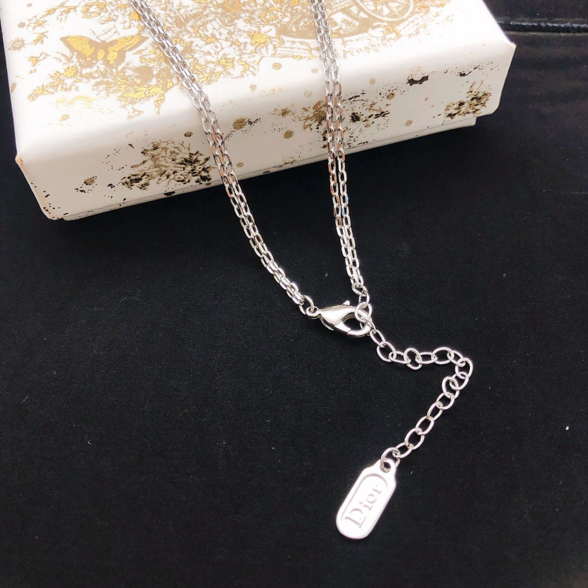 Martin Graham pendant necklace in polished metal-tone – detail view