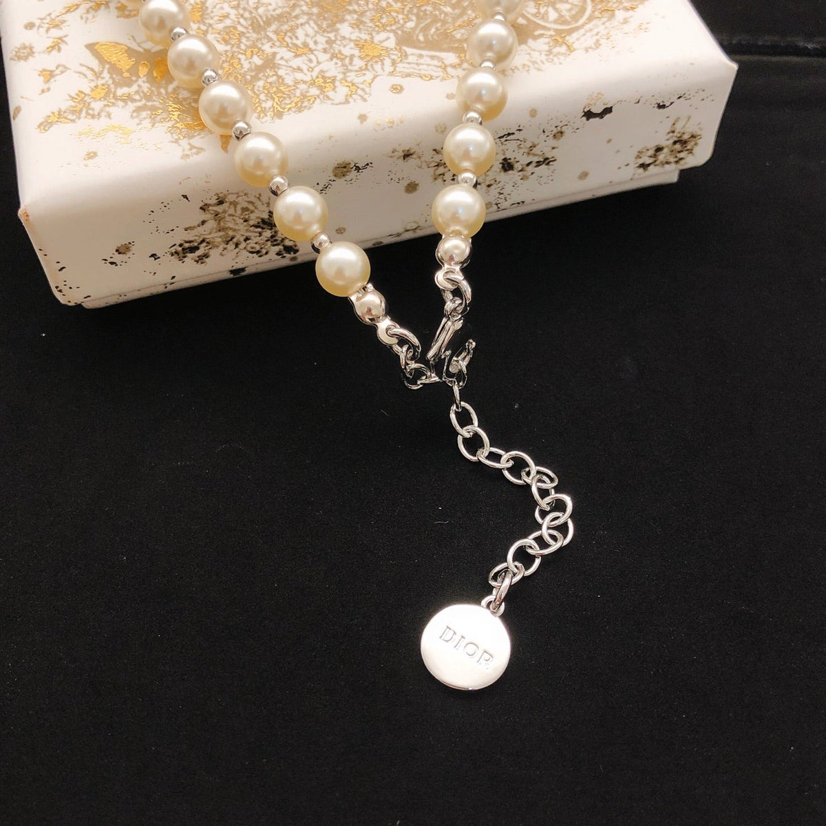 Martin Graham pendant necklace in polished metal-tone – detail view