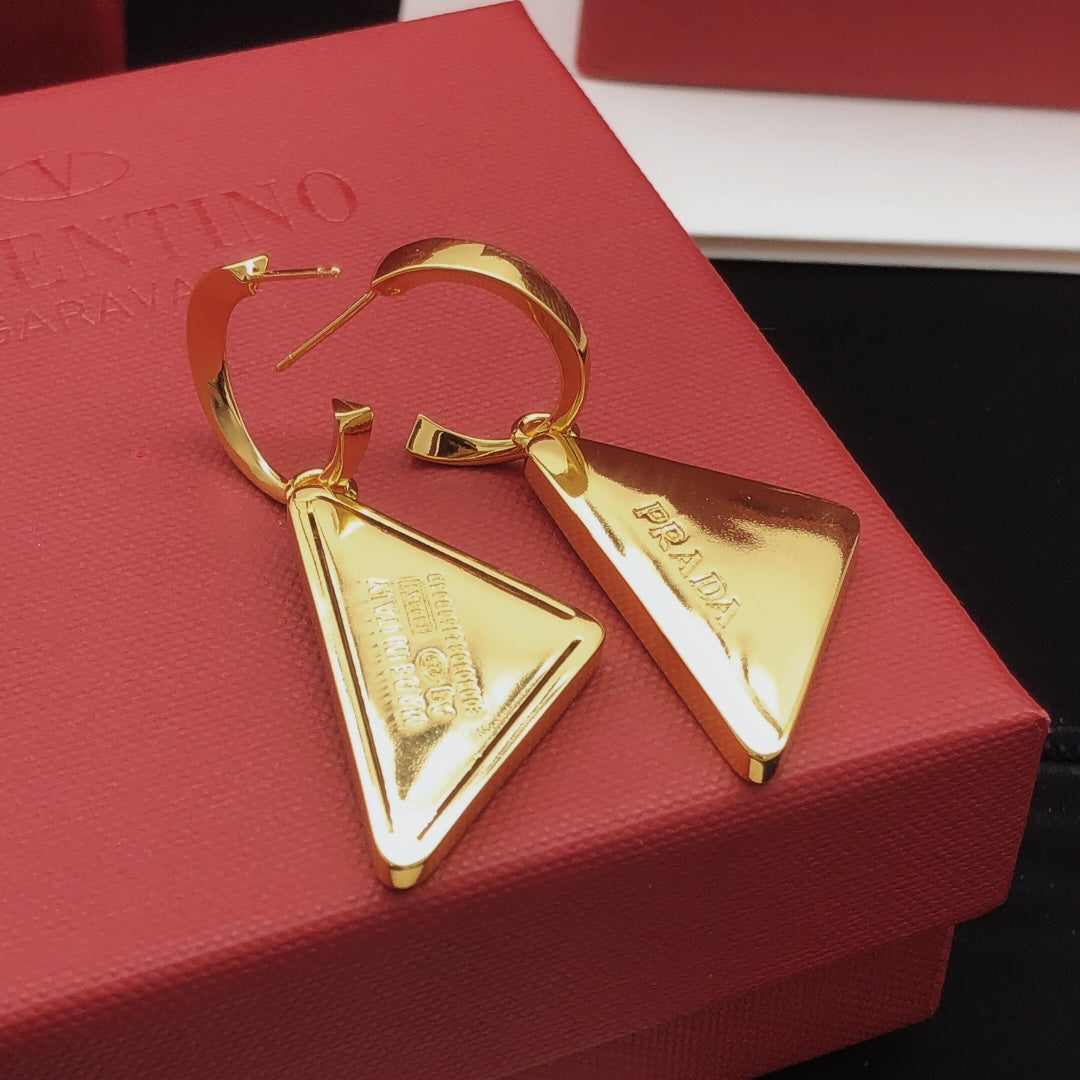 Martin Graham drop earrings in polished metal-tone – detail view