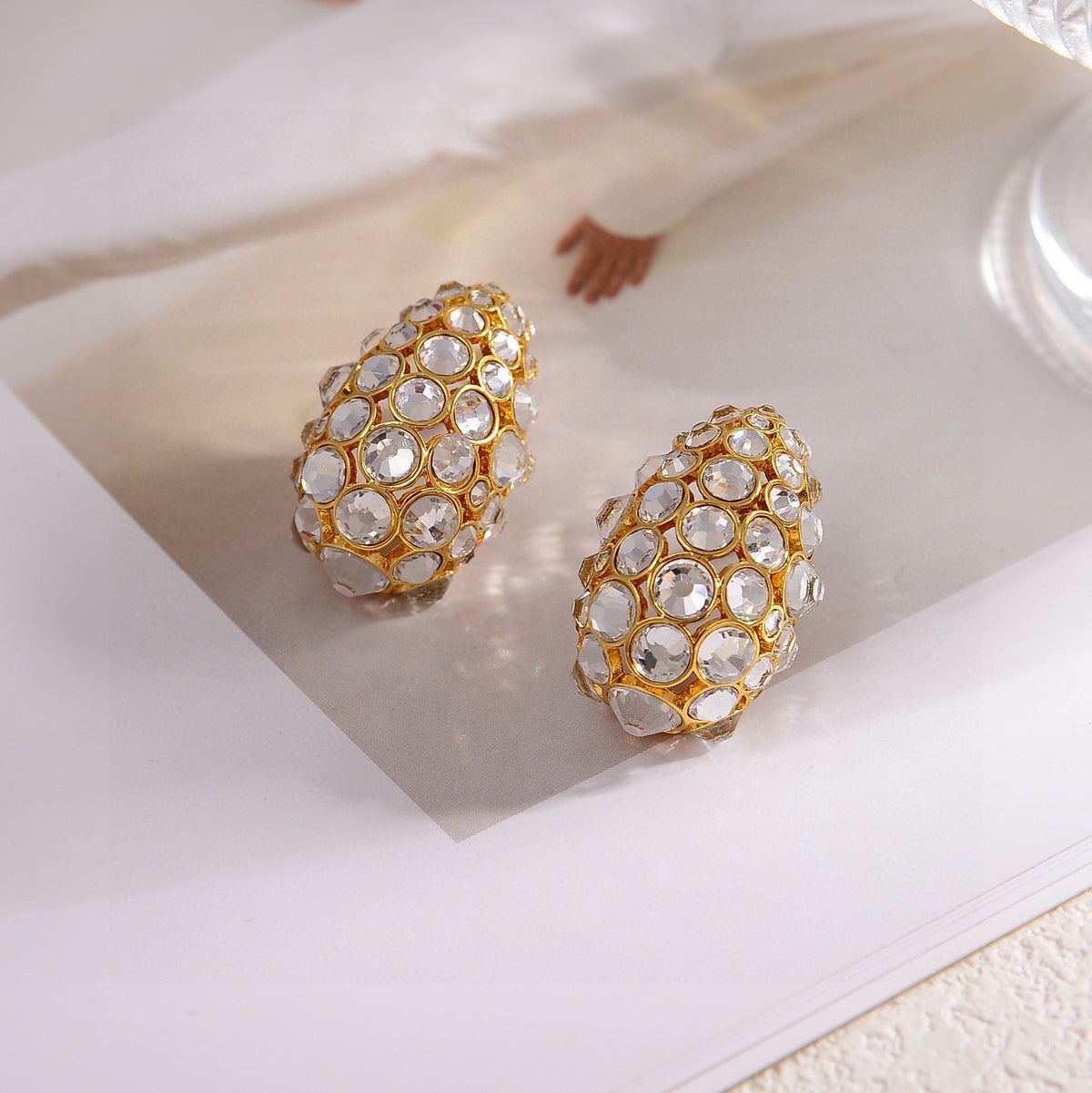 Martin Graham stud earrings in polished metal-tone – detail view