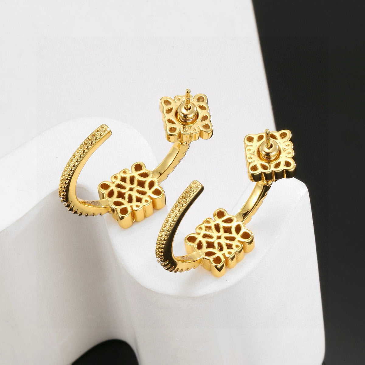 Martin Graham stud earrings in polished metal-tone – detail view