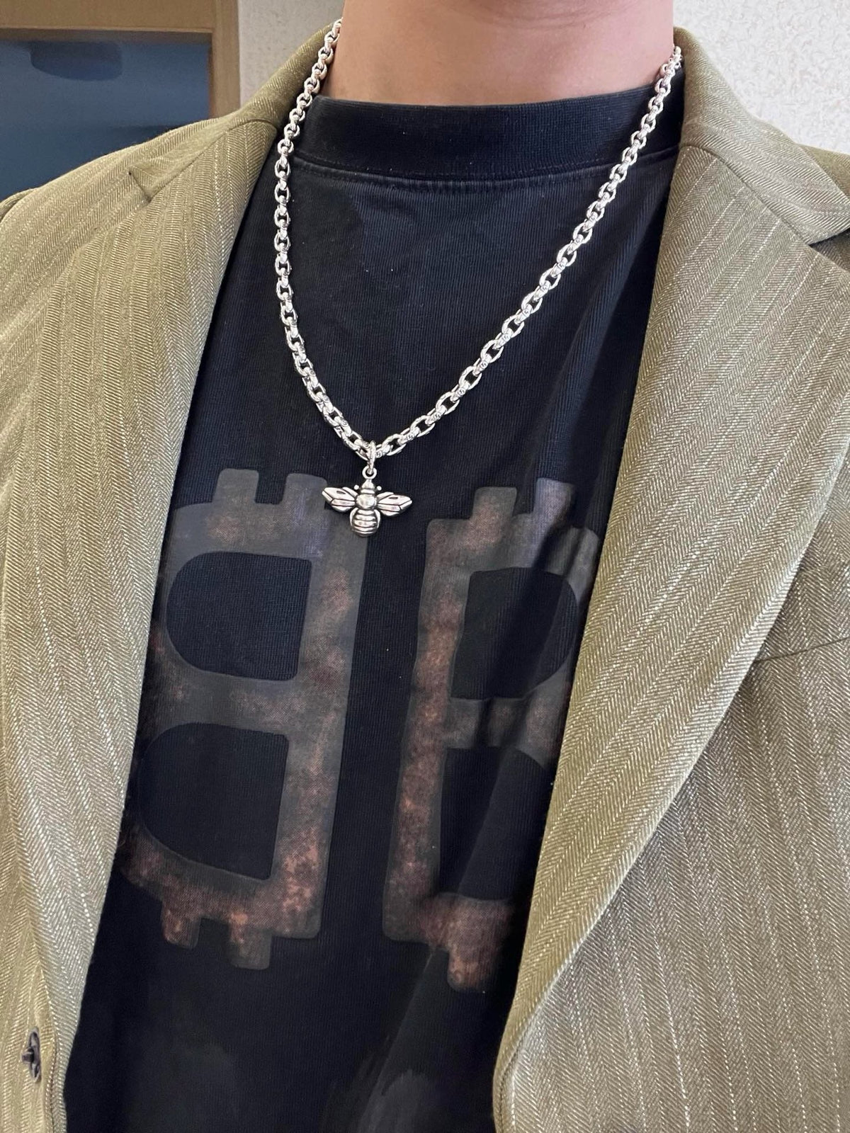 Martin Graham pendant necklace in polished metal-tone – detail view