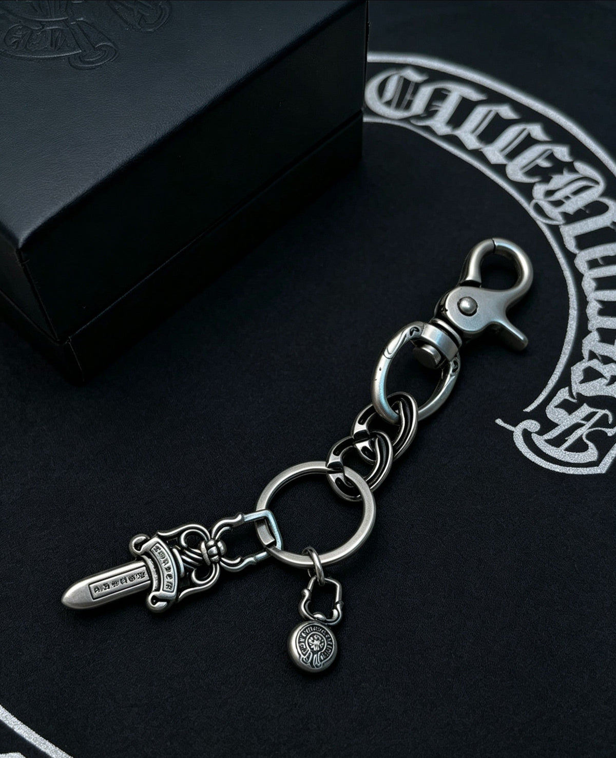 Martin Graham chain accessory in polished metal-tone – detail view