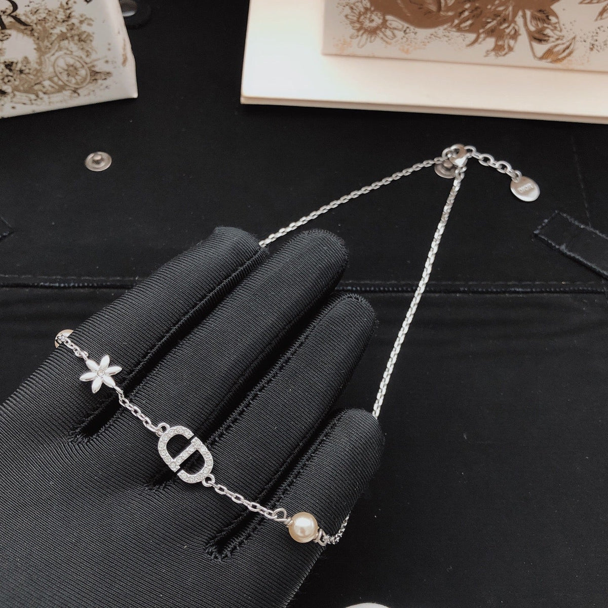 Martin Graham pendant necklace in polished metal-tone – detail view