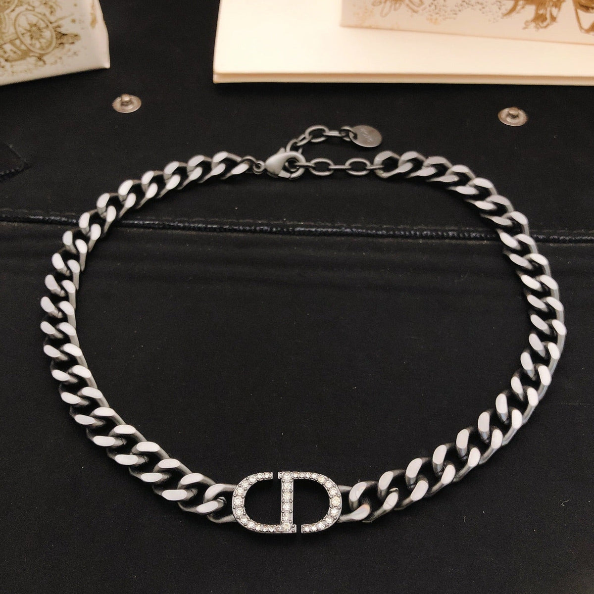 Martin Graham pendant necklace in polished metal-tone – detail view