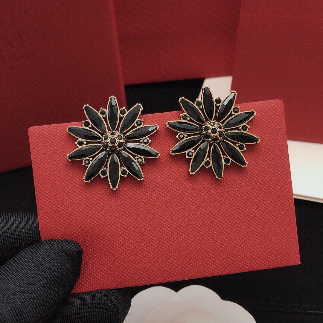 Martin Graham stud earrings in polished metal-tone – detail view