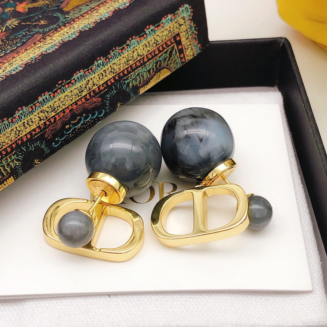 Martin Graham stud earrings in polished metal-tone – detail view