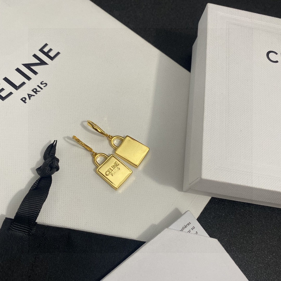 Martin Graham stud earrings in polished metal-tone – detail view