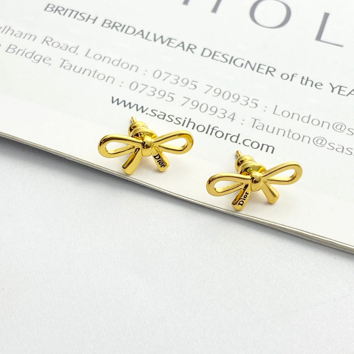 Martin Graham stud earrings in polished metal-tone – detail view