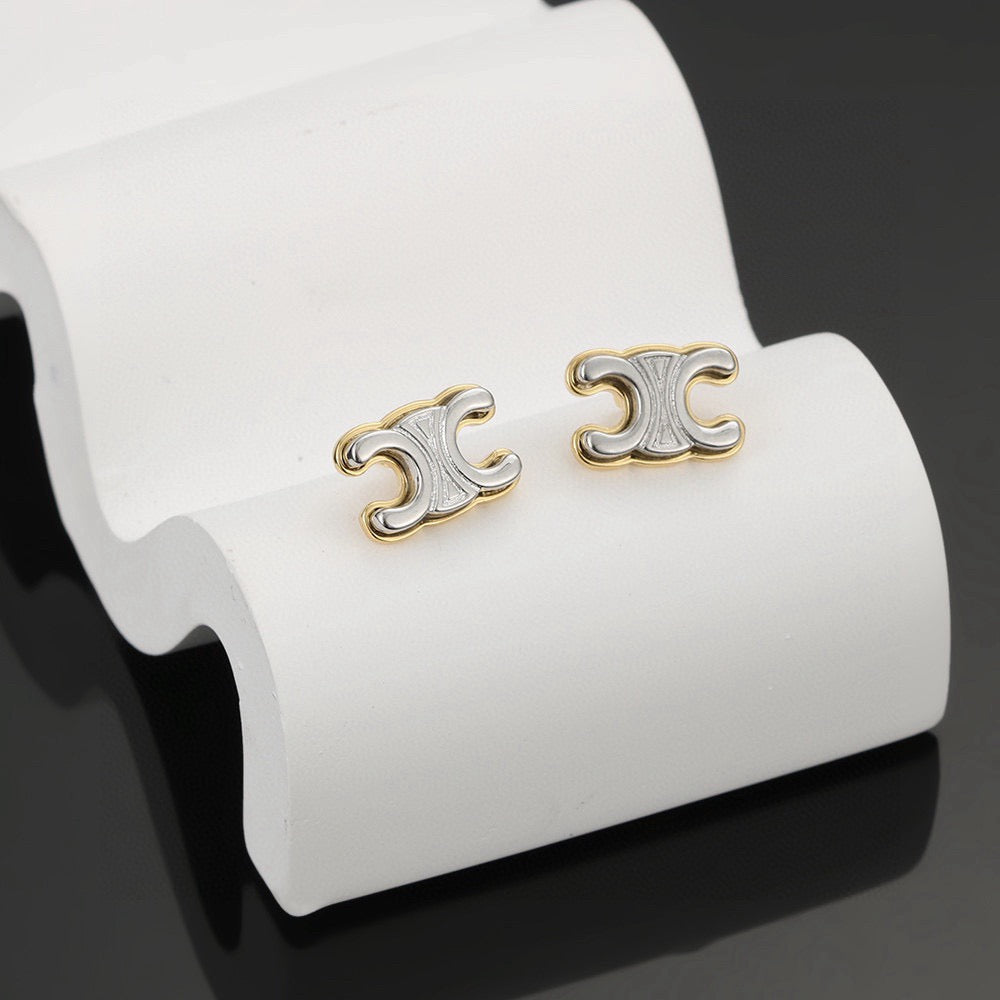 Martin Graham stud earrings in polished metal-tone – detail view