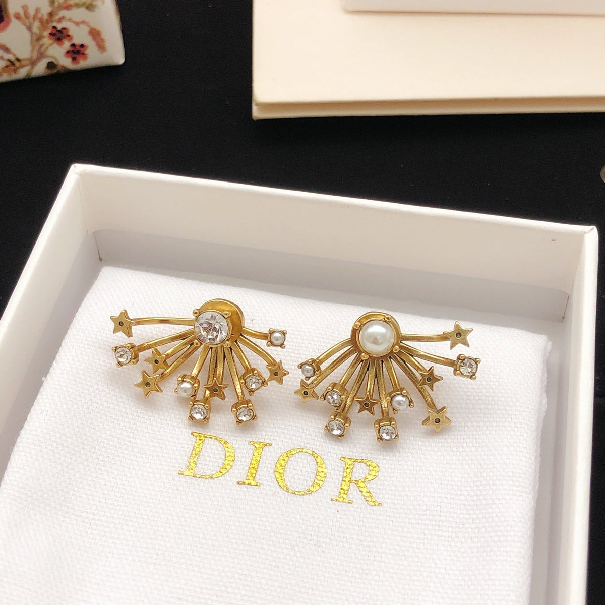 Martin Graham stud earrings in polished metal-tone – detail view