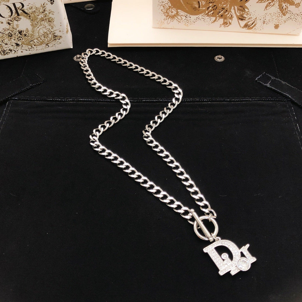 Martin Graham pendant necklace in polished metal-tone – detail view