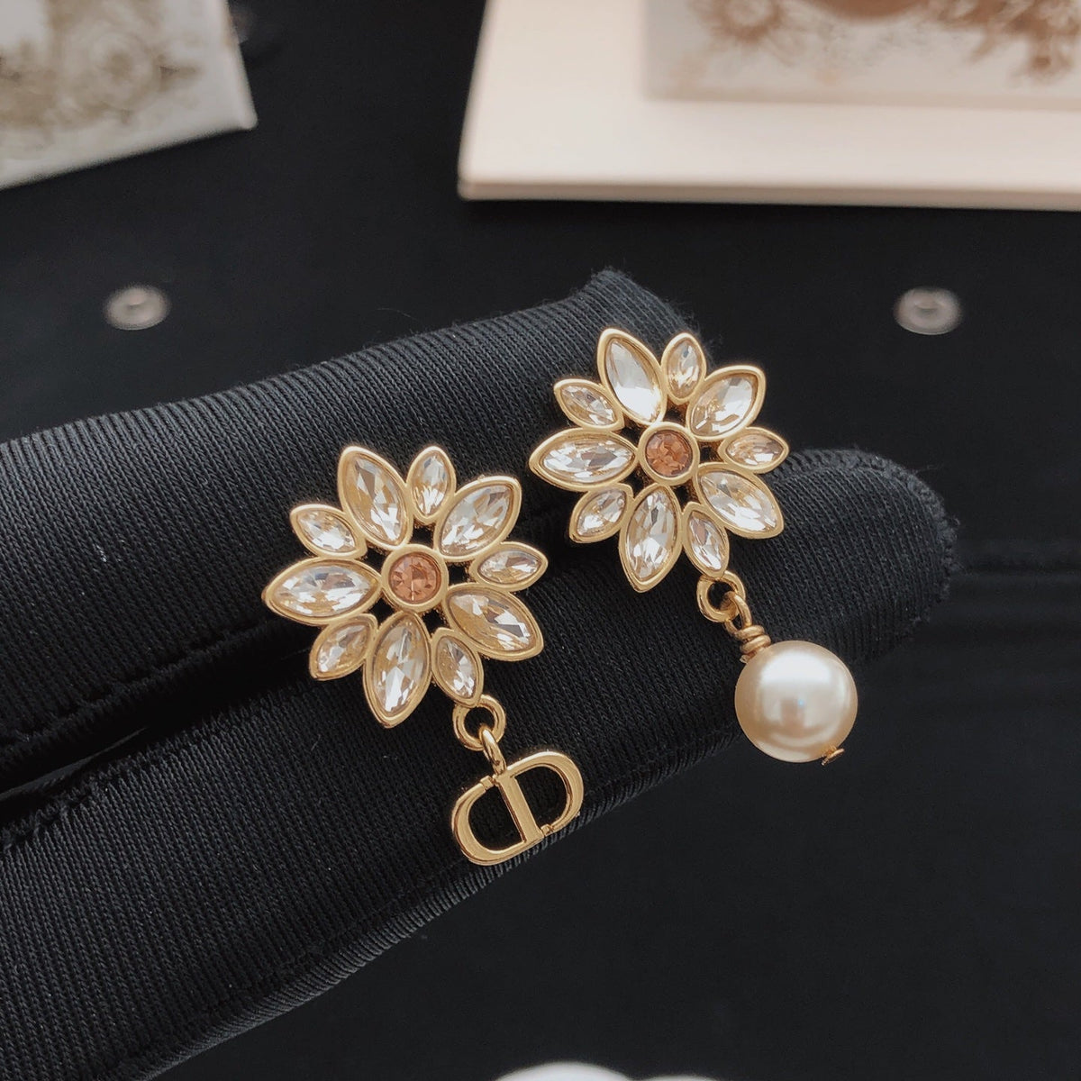 Martin Graham stud earrings in polished metal-tone – detail view