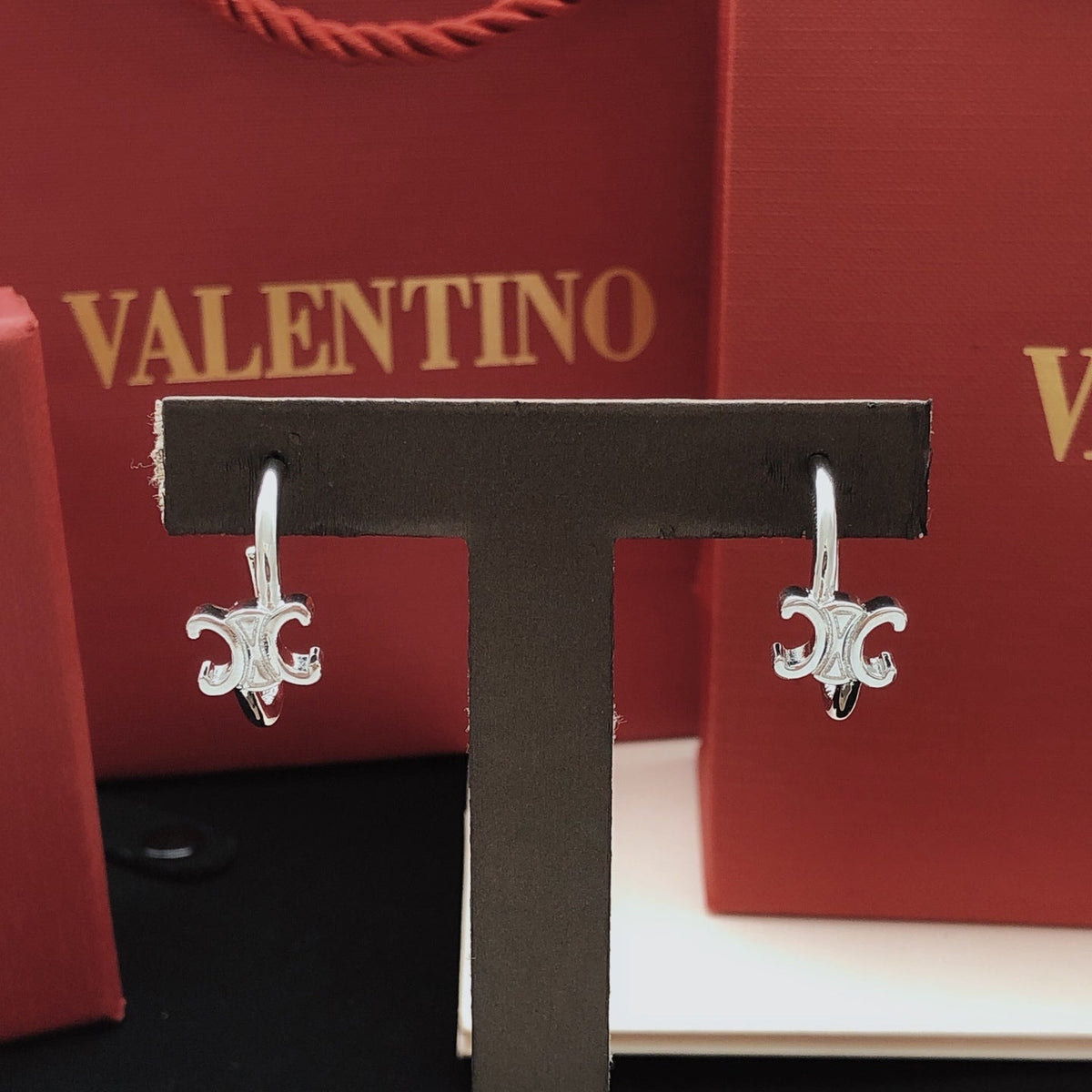 Martin Graham drop earrings in polished metal-tone – detail view
