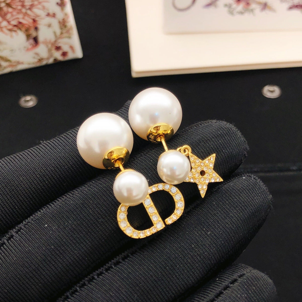 Martin Graham stud earrings in polished metal-tone – detail view