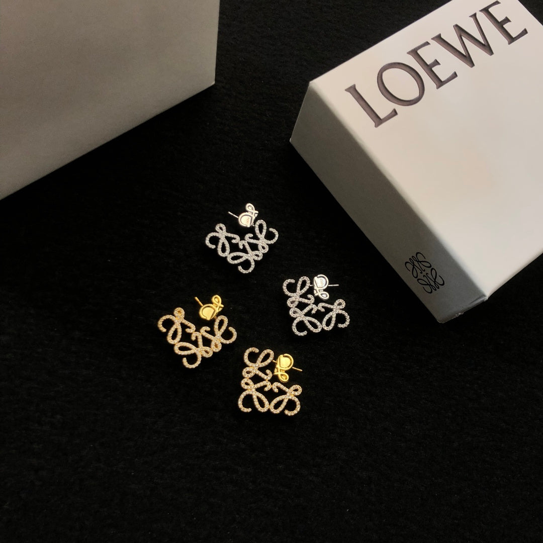 Martin Graham stud earrings in polished metal-tone – side detail