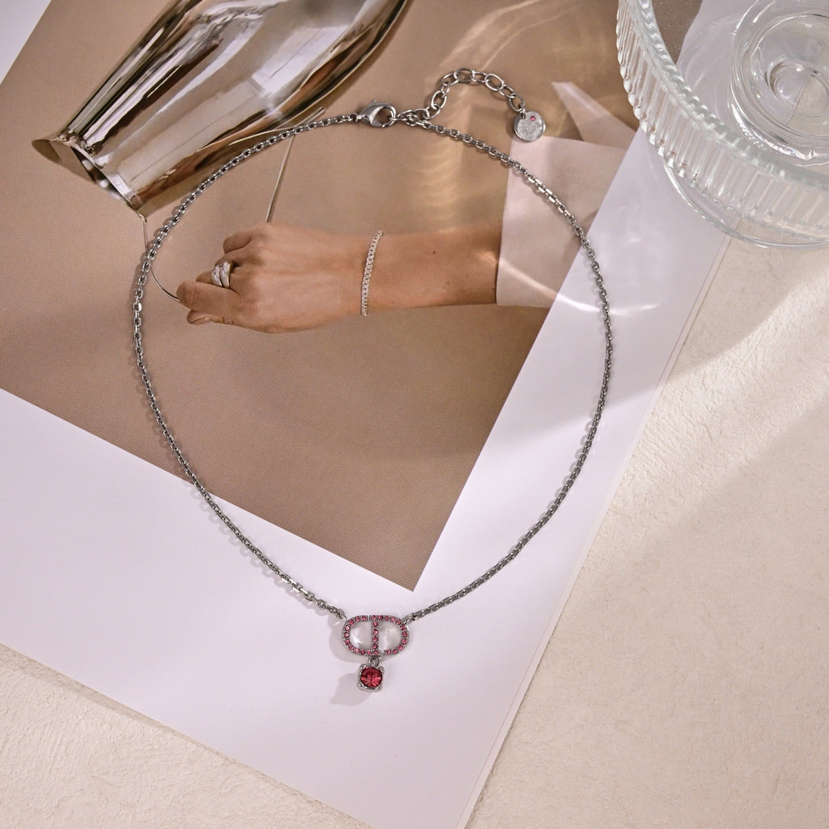 Martin Graham pendant necklace in polished metal-tone – side detail