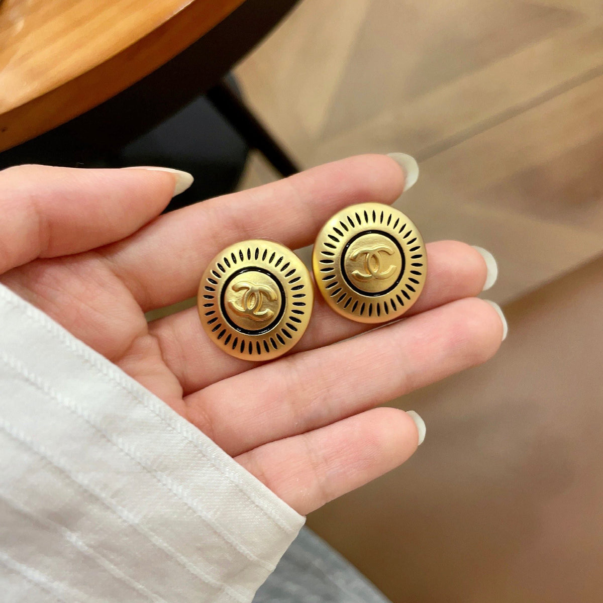Martin Graham stud earrings in polished metal-tone – side detail