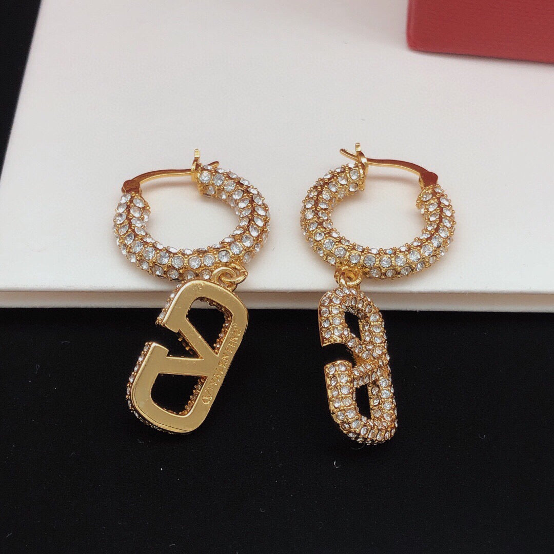 Martin Graham drop earrings in polished metal-tone – side detail