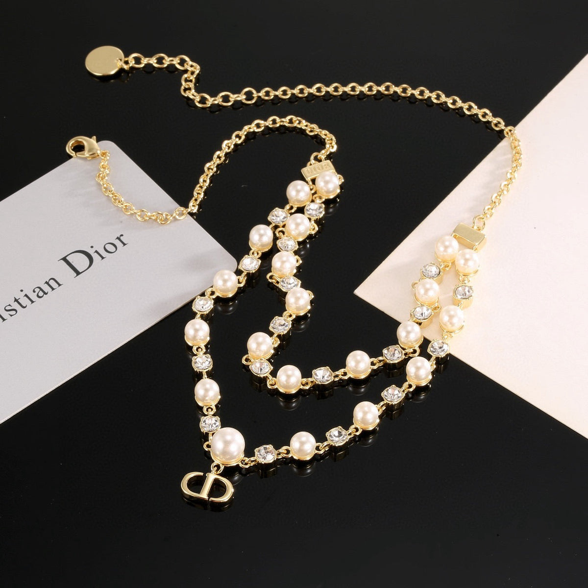Martin Graham pendant necklace in polished metal-tone – side detail