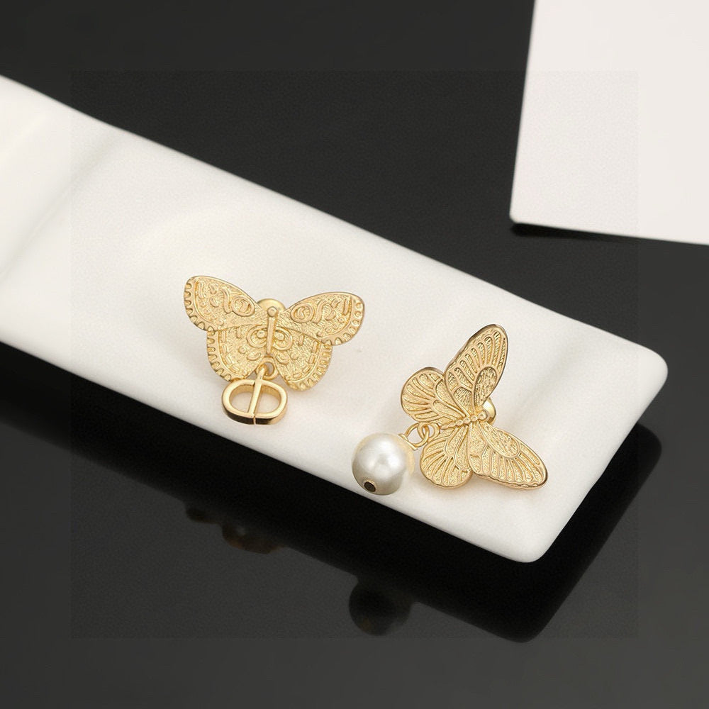 Martin Graham stud earrings in polished metal-tone – side detail