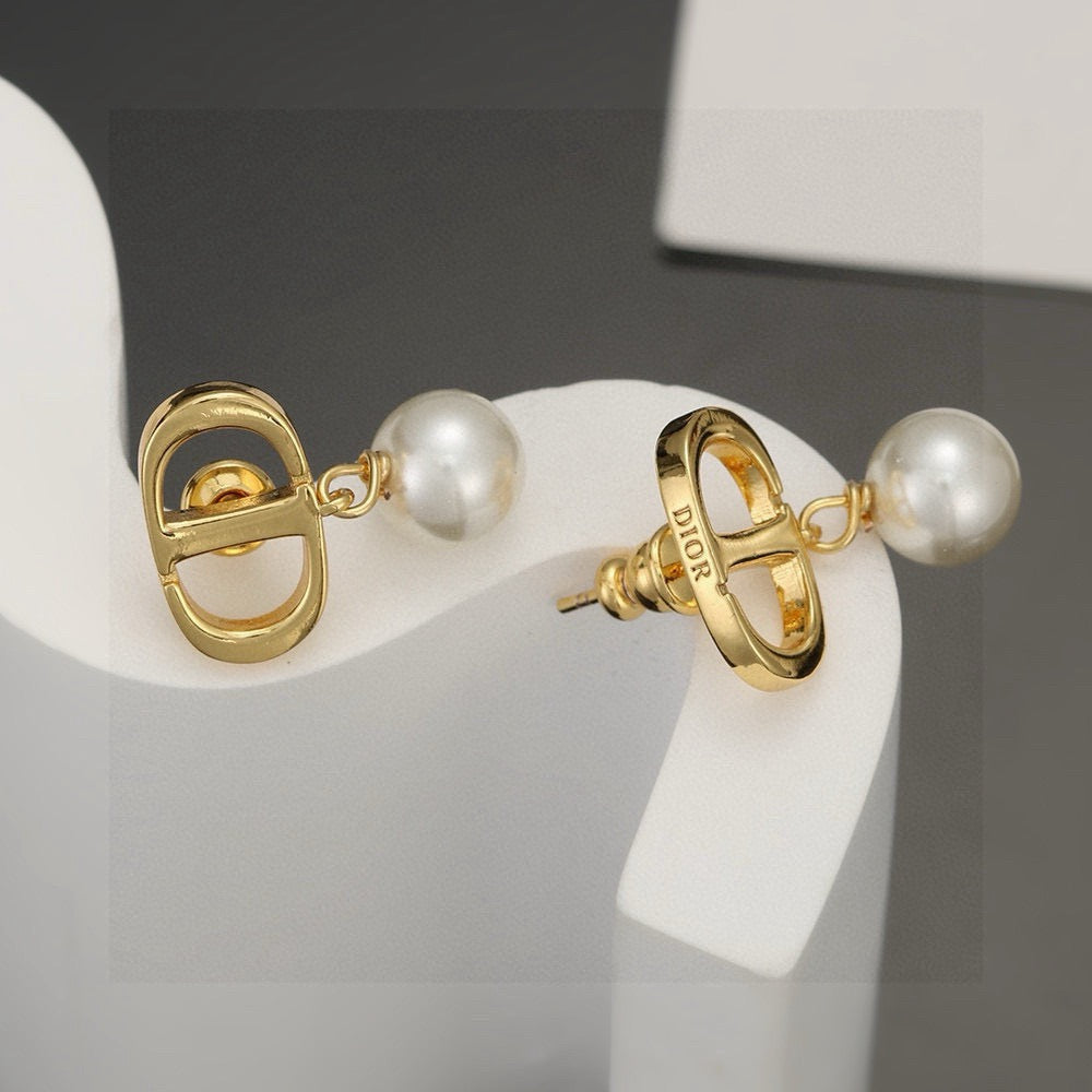 Martin Graham stud earrings in polished metal-tone – side detail