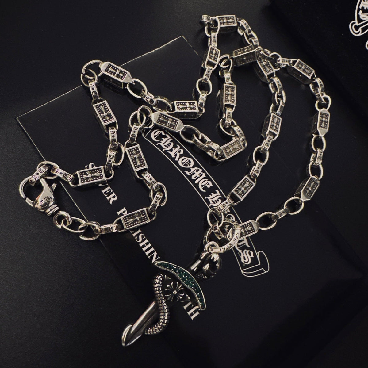 Martin Graham pendant necklace in polished metal-tone – side detail