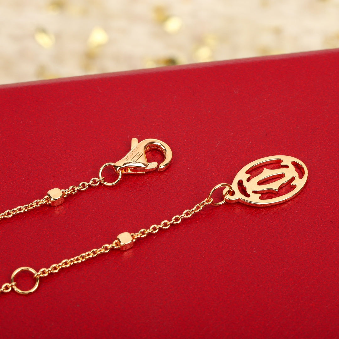 Martin Graham pendant necklace in polished metal-tone – side detail