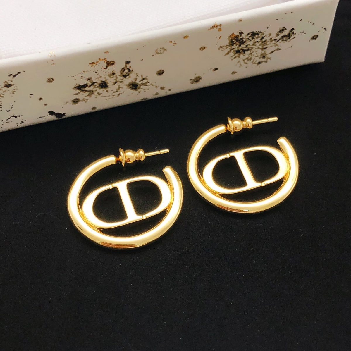 Martin Graham earrings in polished metal-tone – side detail