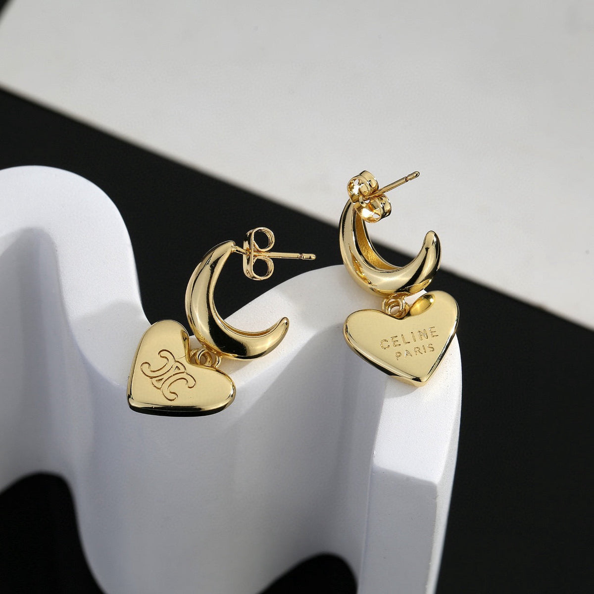 Martin Graham stud earrings in polished metal-tone – side detail