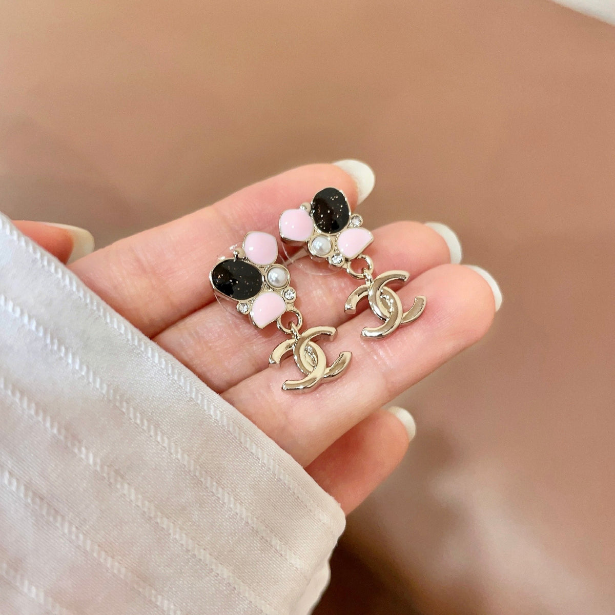 Martin Graham stud earrings in polished metal-tone – side detail