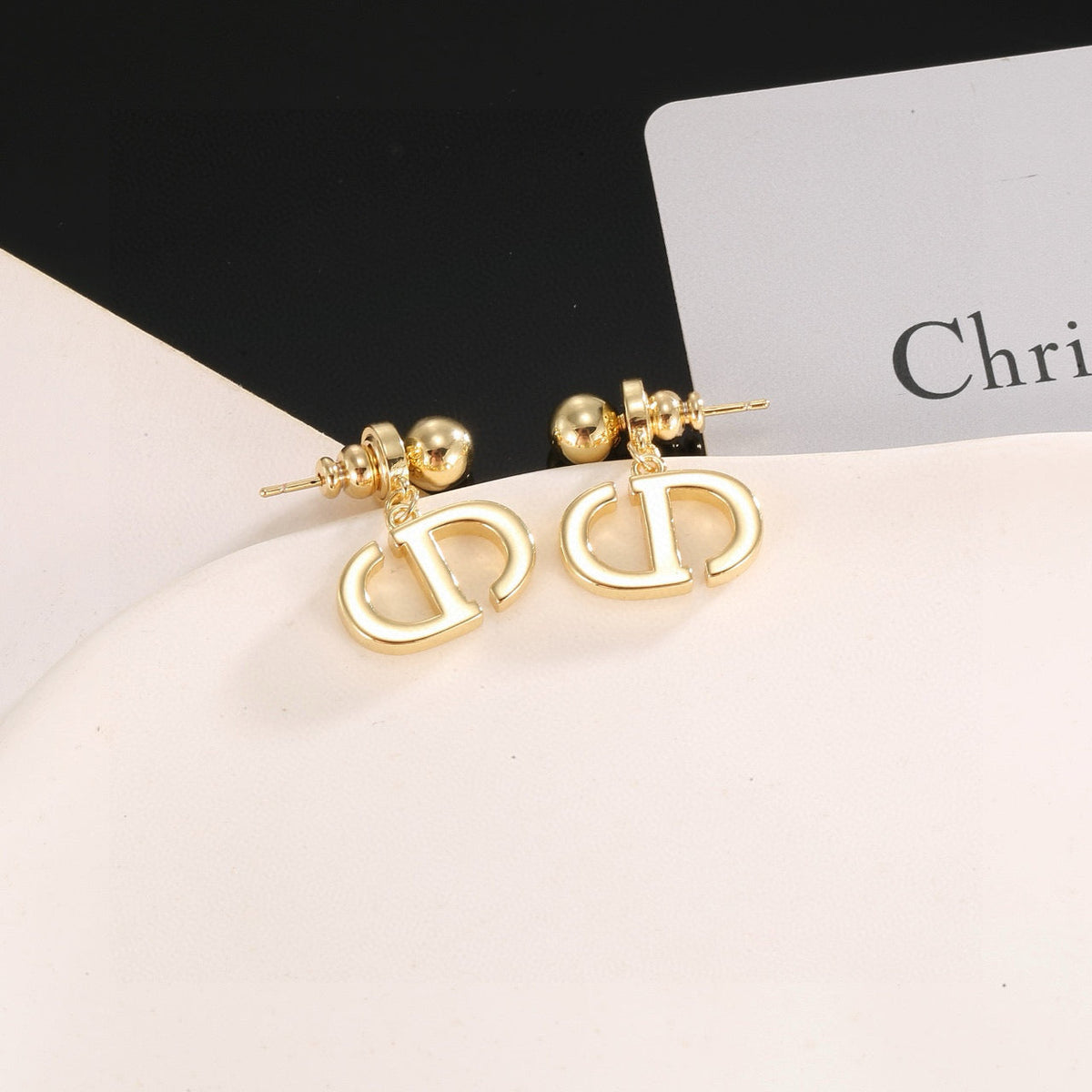 Martin Graham stud earrings in polished metal-tone – side detail
