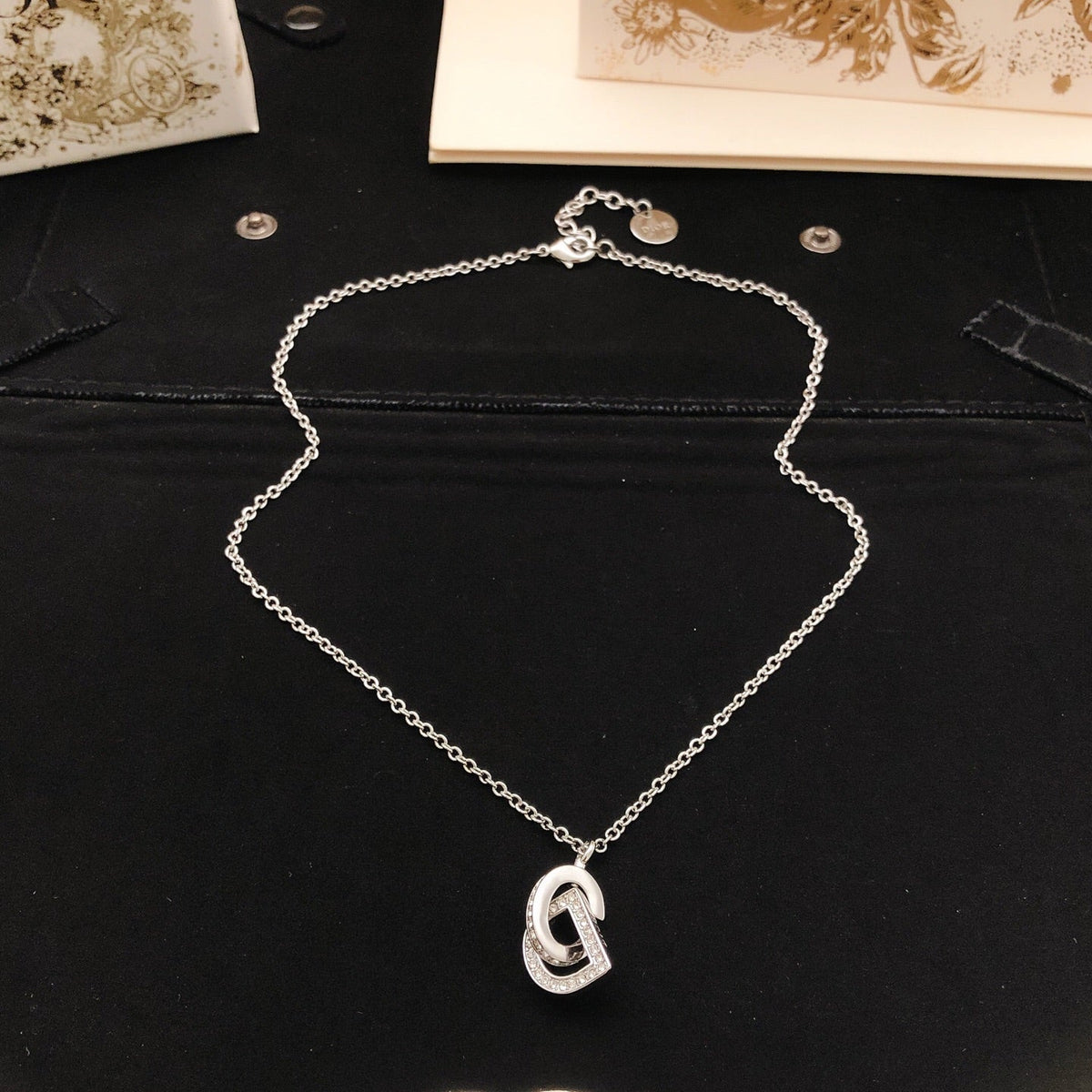 Martin Graham pendant necklace in polished metal-tone – side detail