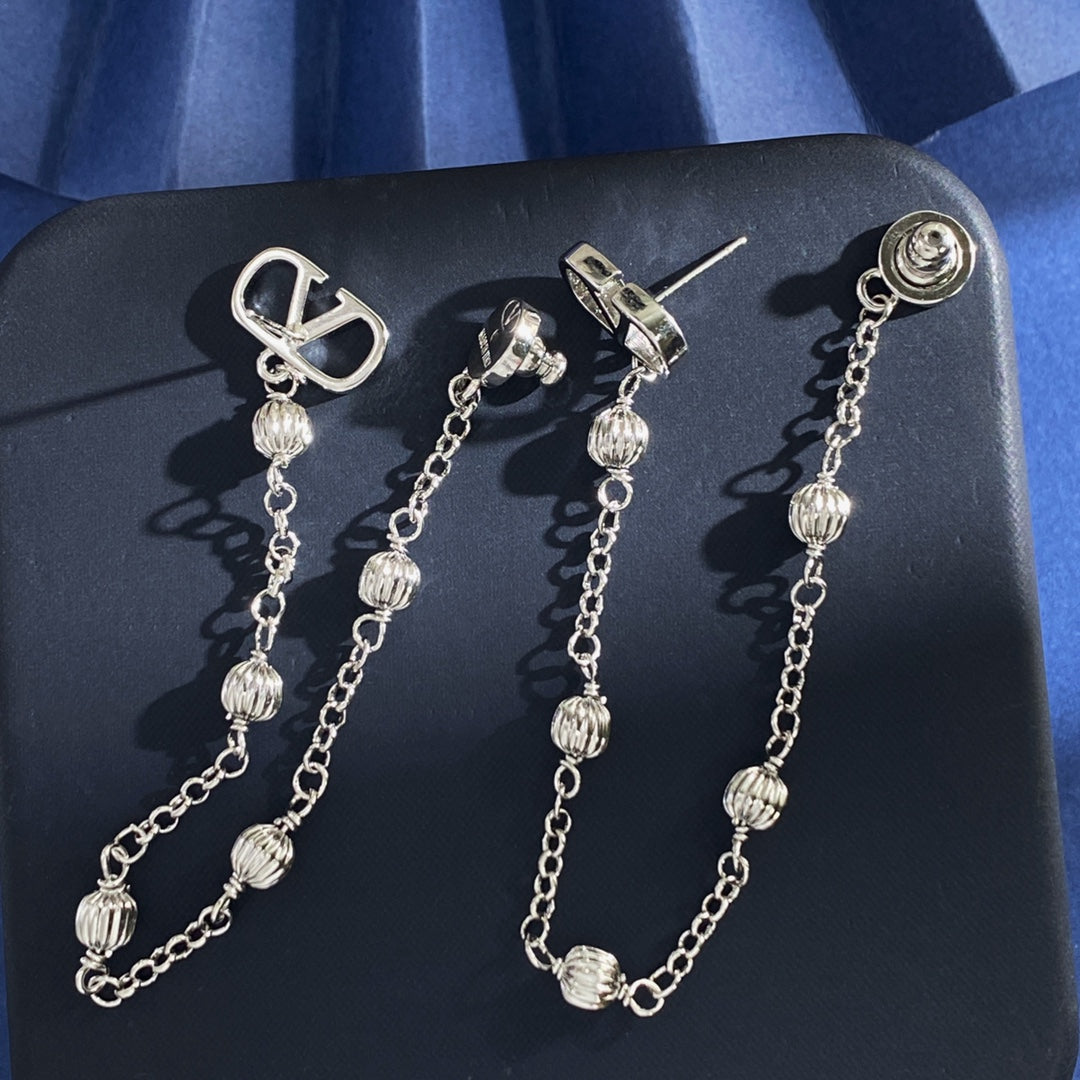 Martin Graham stud earrings in polished metal-tone – side detail