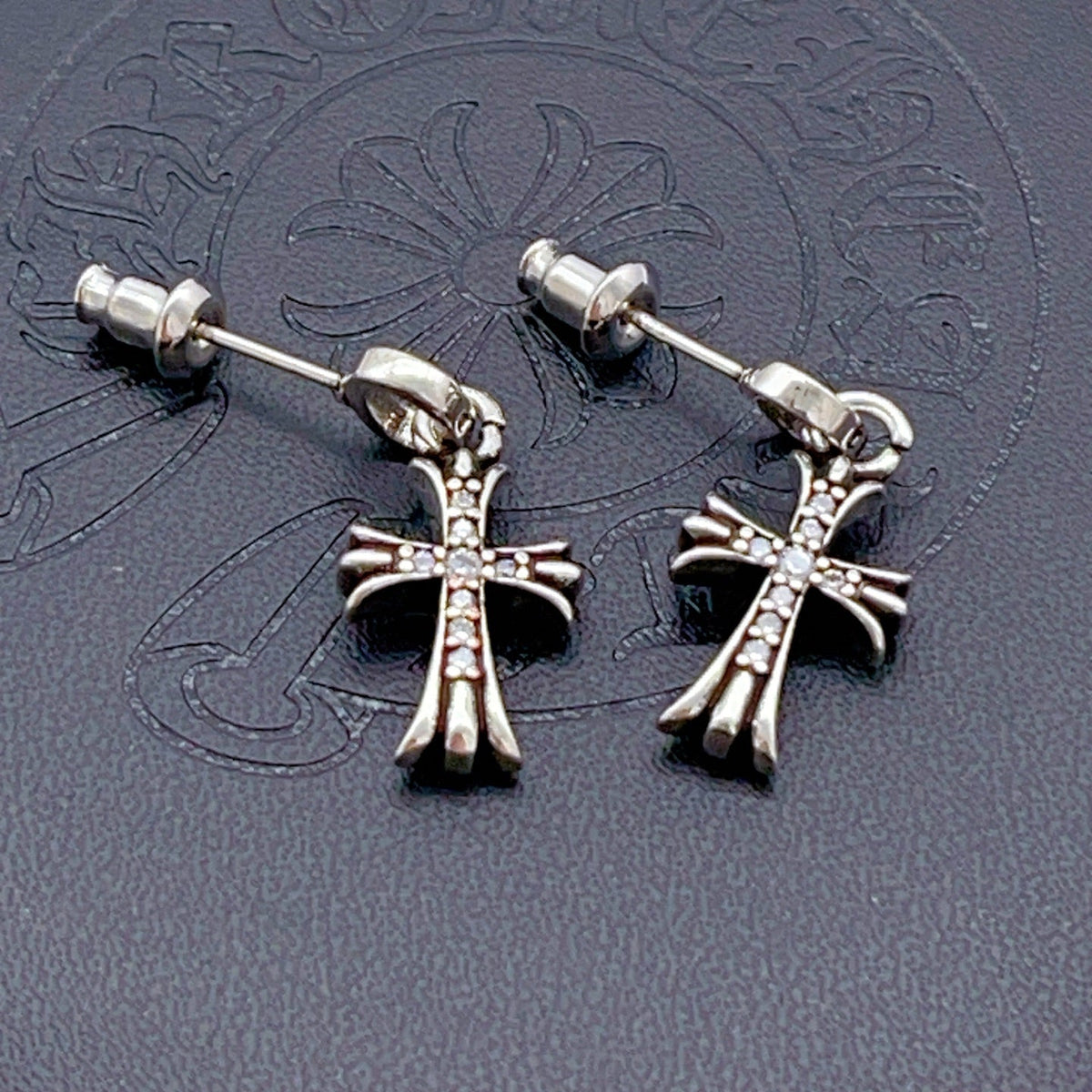 Martin Graham stud earrings in polished metal-tone – side detail