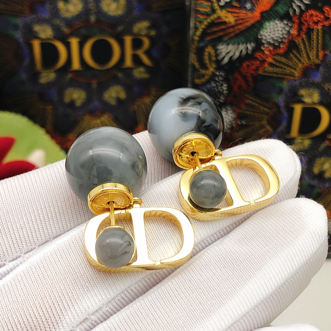 Martin Graham stud earrings in polished metal-tone – side detail