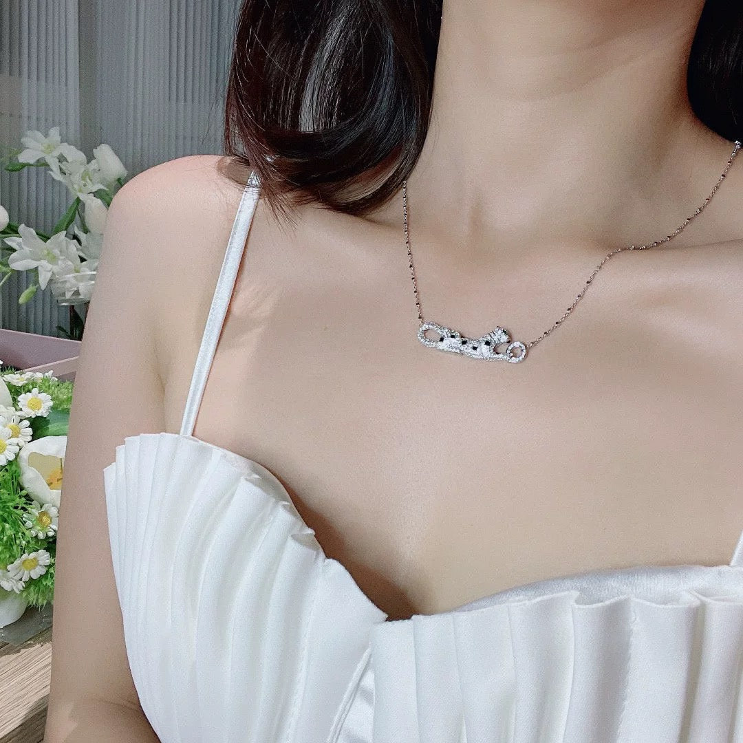 Martin Graham pendant necklace in polished metal-tone – side detail
