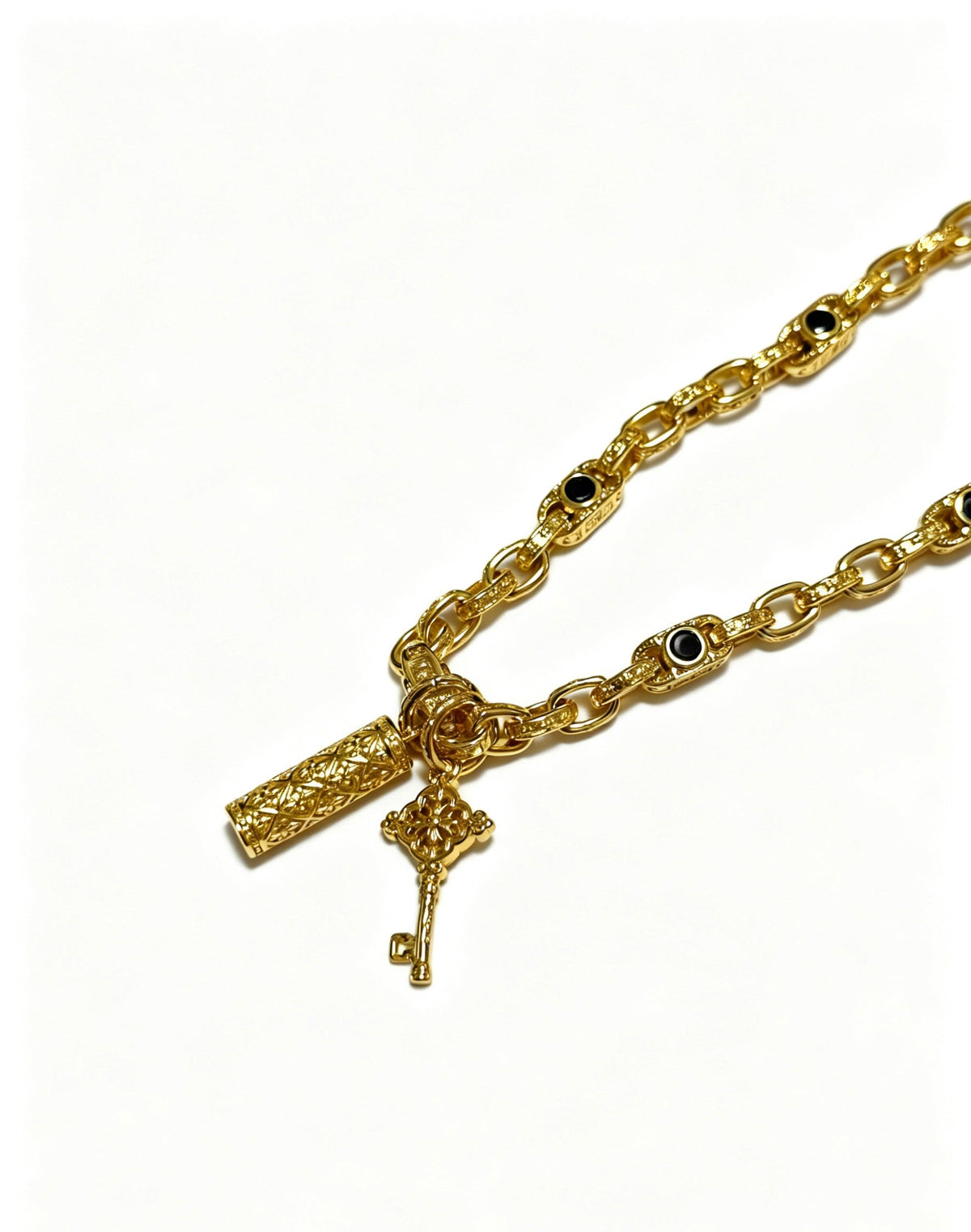 Martin Graham pendant necklace in polished metal-tone – side detail