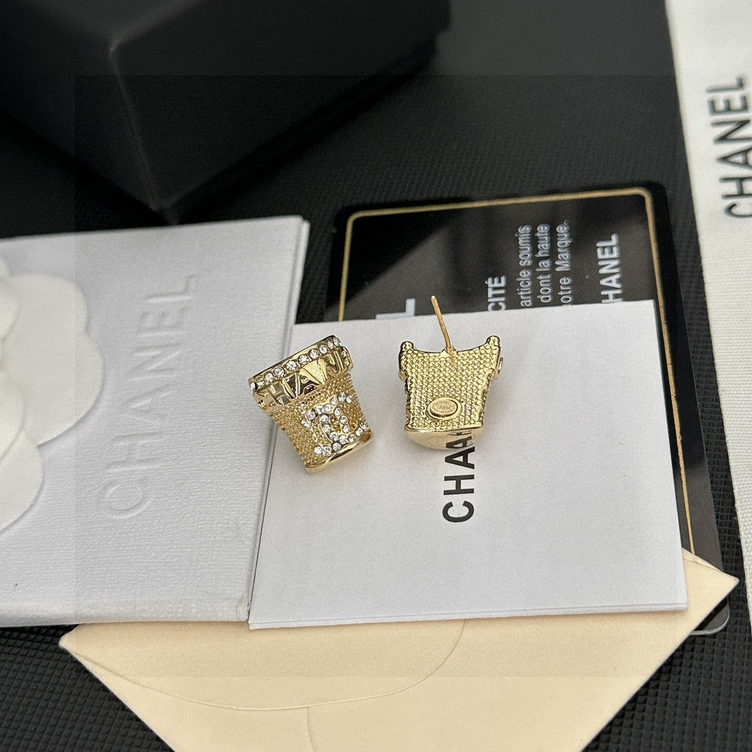 Martin Graham stud earrings in polished metal-tone – side detail